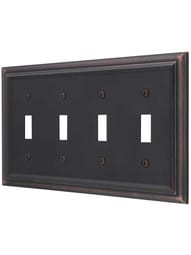 Georgian Quad-Toggle Switch Plate in Aged Bronze.